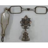 A silver and mother of pearl lorgnette with vacant gold panel to side, length when open 12cm,
