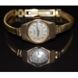 Victor 9ct gold ladies wristwatch with gold hands and Arabic numerals, silver dial, bevelled case
