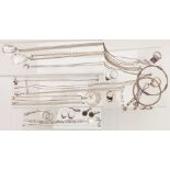 A collection of silver jewellery including pendants, two bangles, nine rings, earrings, necklaces,
