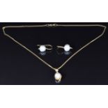 An 18ct gold pendant set with a pearl and diamond, 4.9g, and a pair of yellow metal earrings set