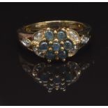 A 9ct gold ring set with round Alexandrite cabochons and diamonds in a cluster, size N, 3.7g