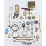A collection of costume jewellery including rolled gold bangle, silver including pendant set with