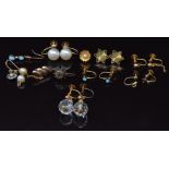 A collection of 9ct gold earrings including a pair set with faux pearls, another pair set with beads