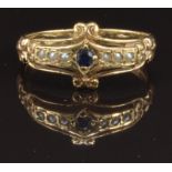 A 9ct gold ring set with a sapphire and seed pearls, size O, 2.8g