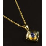 An 18ct gold pendant set with an oval cut tanzanite on 18ct gold chain, 6.2g, length 40cm