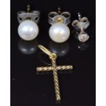 A pair of pearl earrings, a diamond earring and a yellow metal cross pendant