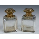 Pair of French perfume bottle with gilt lids, each with a grand tour painting to top, height 7.5cm