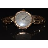 Unnamed 9ct gold ladies wristwatch with blued hands, black Arabic numerals, silver dial and 15 jewel
