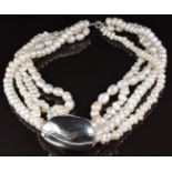 A four strand cultured pearl necklace with large silver slider