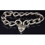 A 9ct gold curb link bracelet with engraved heart padlock clasp, 72g