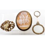 Victorian magnifying glass, large Victorian brooch set with a cameo and another Victorian brooch set