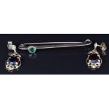 A pair of 9ct gold earrings set with garnets and a bar brooch, 5.4g