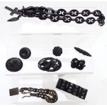 A collection of Victorian jet/ vulcanite jewellery including carved brooches, bracelet and necklaces