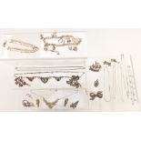 A group of silver jewellery including charm bracelet, curb link bracelet, chains, necklace, brooches