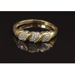 A 9ct gold ring set with diamonds, size Q, 2g