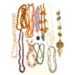 A collection of beaded necklaces including amethyst, agate, malachite, rhodochrosite, amber and rose