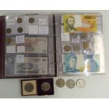 An amateur collection of UK and world coins and banknotes in a collector's folder, together with a