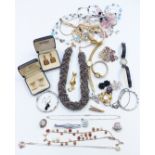 A collection of costume jewellery including cufflinks, silver brooch, silver pendant, necklaces,