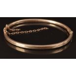 A 9ct rose gold bangle, 4.6g