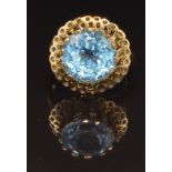 A 9ct gold ring set with a round cut blue topaz, size N, 6.7g