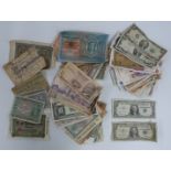 A collection of approximately 70 world banknotes, includes two USA silver $1 certificates