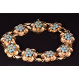 An 18ct gold bracelet set with faux turquoise in flower settings, 13.5g