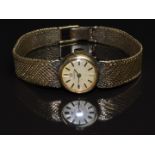 Omega 9ct gold ladies wristwatch with two-tone hands and baton hour markers, gold dial and signed 17