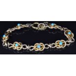 Edwardian yellow metal knot bracelet set with turquoise, 13.2g