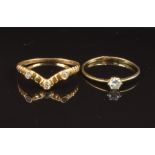 Two yellow metal rings set with paste, sizes R & U, 2.7g