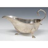 Edward VII hallmarked silver sauce boat, raised on three feet, Birmingham 1903, maker Horace