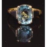 An 18ct gold ring set with a cushion cut aquamarine in a platinum setting, size N, 3.1g