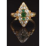 Victorian 18ct gold ring set with one square cut and two round cut emeralds, surrounded by old cut