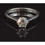 An 18ct white gold ring set with a round cut diamond of approximately 0.4ct, size M, 2.6g