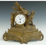French brass figural mantel clock featuring a hunting dog and hare, the enamel Roman dial with