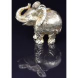 An 18ct gold elephant pendant set with diamond eyes, 2.5 x 3.2cm, 28.6g