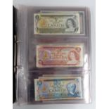 A collection of banknotes in a folder, to include Canada, Scotland, Clydesdale, UK,  Hong King and
