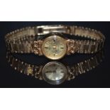 Rotary 9ct gold ladies wristwatch with two-tone gold and black hands, gold hour markers and dial and