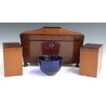 19thC flame mahogany sarcophagus shaped tea caddy with Bristol blue glass mixing bowl, raised on bun