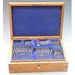 Early 20thC oak cased 12 place setting canteen of silver plated cutlery with ivorine plaque for John