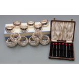 Newbridge silverware boxed set of six napkin rings, further set of six wirework napkin rings and a