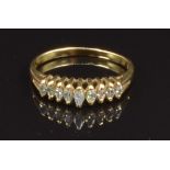 An 18ct gold ring set with marquise cut diamonds, size M, 2.2g