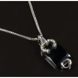 An 18ct white gold pendant set with onyx and diamonds on 18ct white gold chain, 6.4g, length 38cm