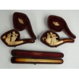 Two Meerschaum pipes and a cheroot holder, all in original boxes