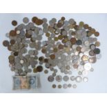 A quantity of UK and overseas coinage, includes a George II halfpenny, some silver and a 1958 '