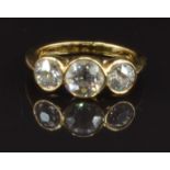 An 18ct gold ring set with three round cut diamonds of approximately 0.8ct, 0.4ct and 0.4ct, size L,