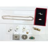 A collection of silver jewellery including eight silver rings, filigree brooches, lighter, etc