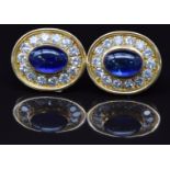 A pair of 18ct gold earrings set with Sri Lankan sapphire cabochons of approximately 5ct, surrounded