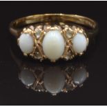 A 9ct gold ring set with opals and paste, size T, 3.3g