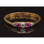 An early 20thC 18ct gold ring set with old cut diamonds and rubies, size R, 1.9g
