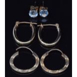 Two pairs of 9ct gold earrings and a pair of 9ct gold earrings set with topaz, 1.7g